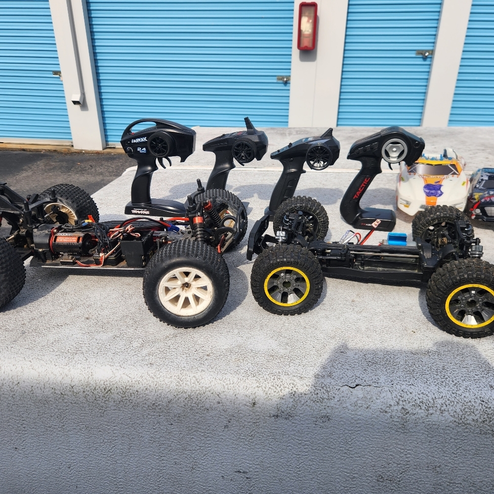 3 rc cars 3 shells 4 controllers 1 battery 1 charger